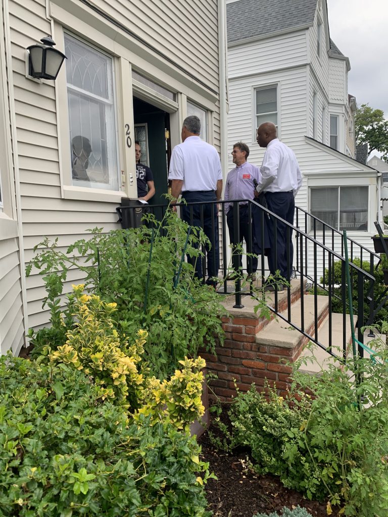 Campaign volunteers gathered outside a Clifton residence.